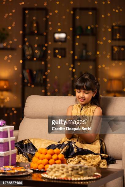 child gril diwali celebrate - stock photo - sweet indian home stock pictures, royalty-free photos & images