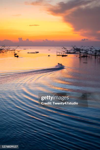 view of pakpra fisherman village at sunrise - thale noi stock pictures, royalty-free photos & images