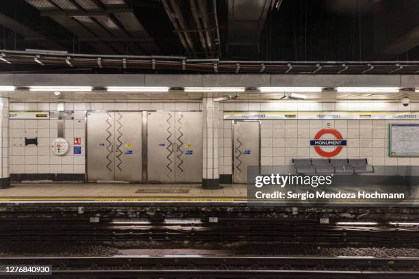 an empty monument subway station - london, england - monument station london stock pictures, royalty-free photos & images