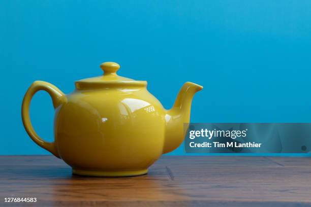 yellow teapot - tea pot stock pictures, royalty-free photos & images