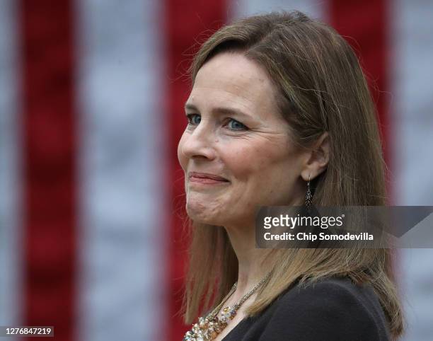Seventh U.S. Circuit Court Judge Amy Coney Barrett looks on while being introduced by U.S. President Donald Trump as his nominee to the Supreme Court...