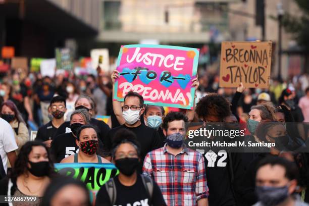 People march for the third day since the release of the grand jury report on the death of Breonna Taylor on September 26, 2020 in Louisville,...