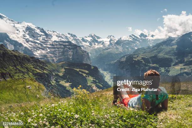 woman hiker enjoying in panoramic view of swiss alps - switzerland summer stock pictures, royalty-free photos & images