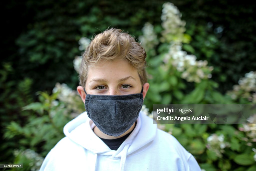 Portrait of a Young Teen Boy Wearing Protective Face Mask