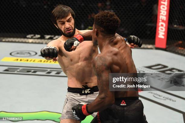 Hakeem Dawodu of Canada punches Zubaira Tukhugov of Russia in their featherweight bout during UFC 253 inside Flash Forum on UFC Fight Island on...