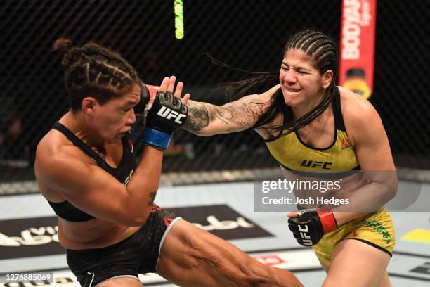 Ketlen Vieira of Brazil punches Sijara Eubanks in their women's bantamweight bout during UFC 253 inside Flash Forum on UFC Fight Island on September...