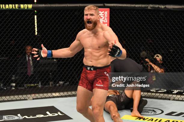 Jan Blachowicz of Poland reacts after defeating Dominick Reyes in their light heavyweight championship bout during UFC 253 inside Flash Forum on UFC...