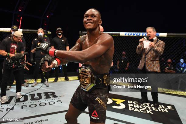 Israel Adesanya of Nigeria celebrates after defeating Paulo Costa of Brazil in their middleweight championship bout during UFC 253 inside Flash Forum...