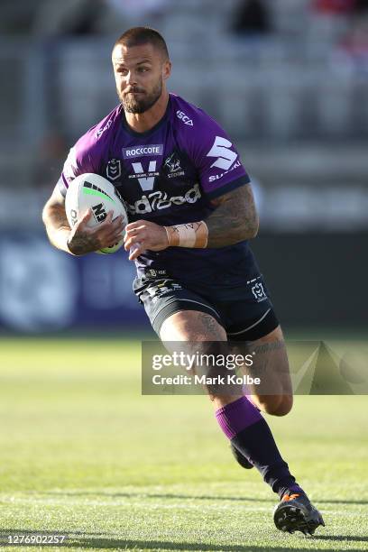 Sandor Earl of the Storm runs at the defense during the round 20 NRL match between the St George Illawarra Dragons and the Melbourne Storm at...