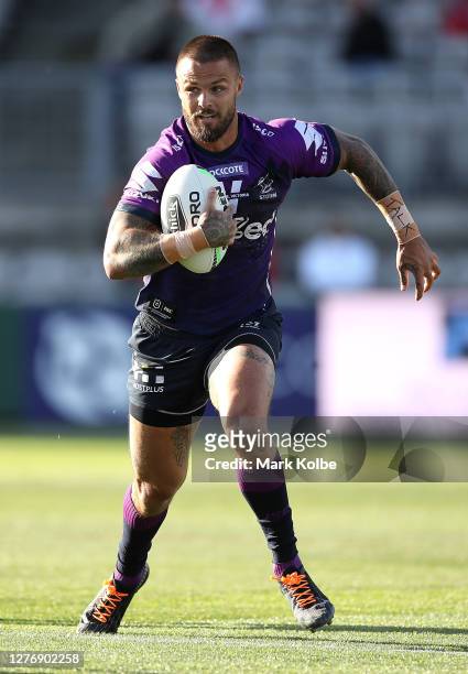 Sandor Earl of the Storm runs at the defense during the round 20 NRL match between the St George Illawarra Dragons and the Melbourne Storm at...