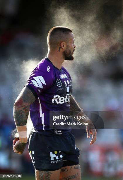 Sandor Earl of the Storm sprays himself during the round 20 NRL match between the St George Illawarra Dragons and the Melbourne Storm at Netstrata...