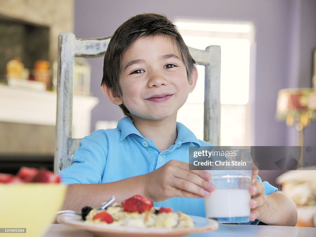 Young Boy Eating Breakfast