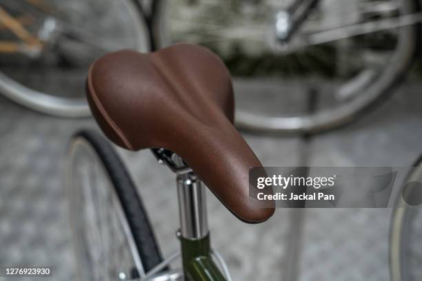 high angle view of bicycle on floor - bicycle seat stock pictures, royalty-free photos & images