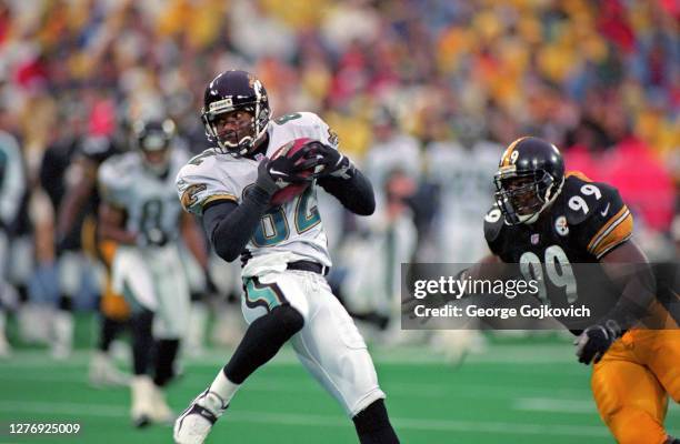 Wide receiver Jimmy Smith of the Jacksonville Jaguars catches a pass against linebacker Levon Kirkland of the Pittsburgh Steelers during a game at...