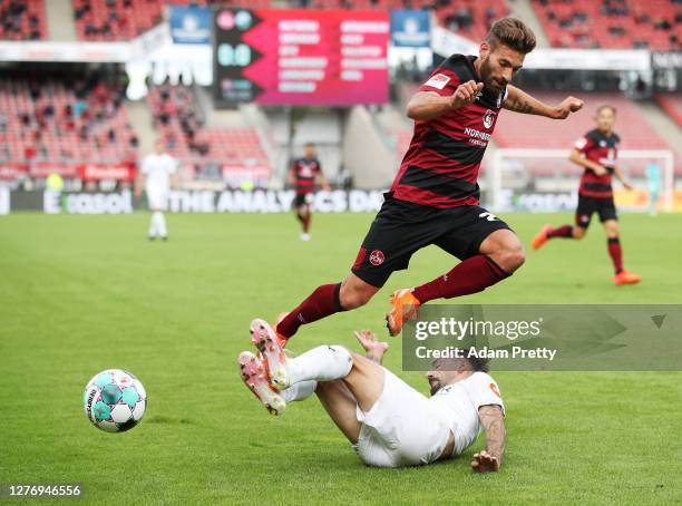 Enrico Valentini of 1. FC Nuernberg is challenged by Diego Contento of SV Sandhausen during the Second Bundesliga match between 1. FC Nürnberg and SV...