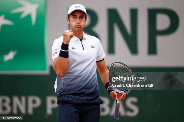 Elliot Benchetrit of France celebrates after winning a point during his Men's Singles first round match against John Isner of the United States...