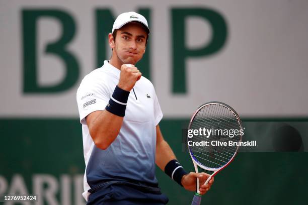 Elliot Benchetrit of France celebrates after winning a point during his Men's Singles first round match against John Isner of the United States...