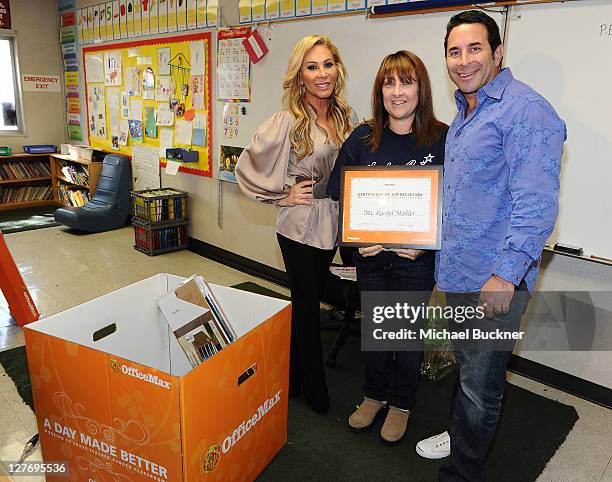 Adrienne Maloof and her husband, Dr. Paul Nassif join OfficeMax in surprising Kester Elementary school teacher Rachel Mahler with $1,000 in classroom...