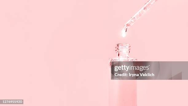 cosmetics concept with fluid hyaluronic acid on pink. - enzymes cosmetics foto e immagini stock