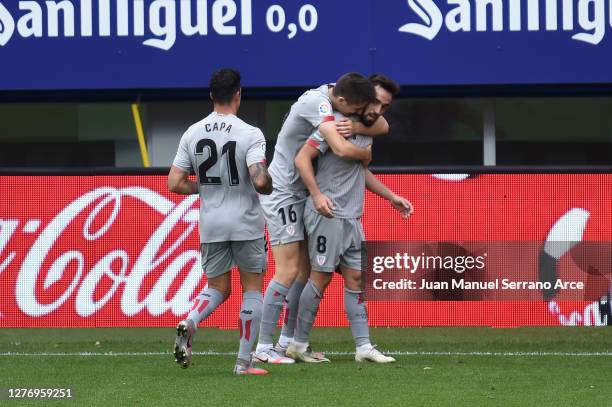 Unai Lopez of Athletic Bilbao celebrates with teammates after scoring his sides second goal during the La Liga Santander match between SD Eibar and...