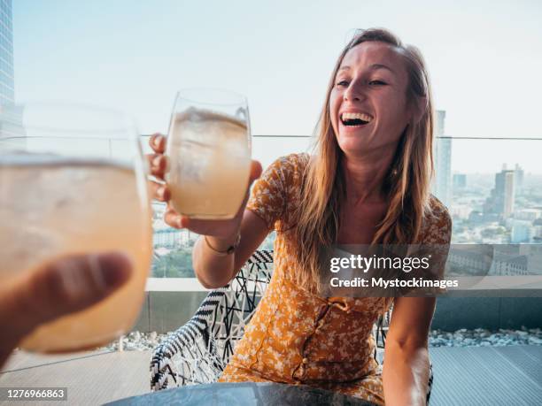 couple cheering with cocktail drinks - bangkok hotel stock pictures, royalty-free photos & images