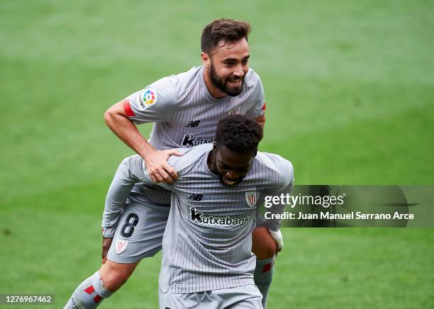 Unai Lopez of Athletic Bilbao celebrates with teammate Inaki Williams after scoring his sides first goal during the La Liga Santander match between...