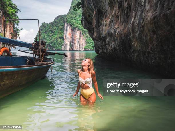 young woman discovering secret lagoon in thailand - koh chang stock pictures, royalty-free photos & images