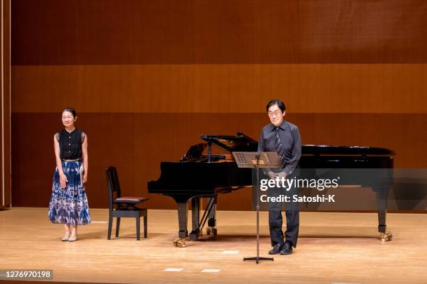 musicians bowing before starting classical concert - bow musical equipment stock pictures, royalty-free photos & images