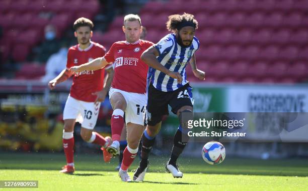 Sheffield Wednesday player Izzy Brown beats Andreas Weimann to the ball during the Sky Bet Championship match between Bristol City and Sheffield...