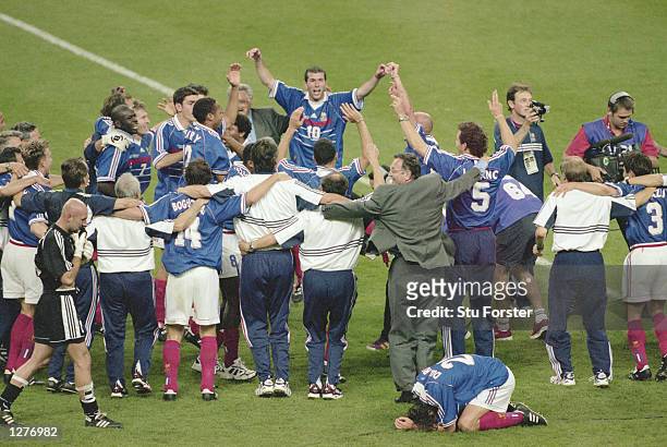 Zinedine Zidane of France is hailed by his team mates after a match winning performance in the World Cup Final against Brazil at the Stade de France...