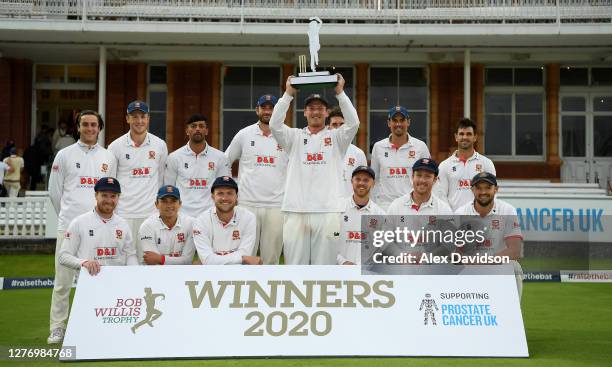 Tom Westley of Essex lifts the Bob Willis Trophy with teammates after Day 5 of the Bob Willis Trophy Final between Somerset and Essex at Lord's...