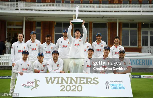 Tom Westley of Essex lifts the Bob Willis Trophy with teammates after Day 5 of the Bob Willis Trophy Final between Somerset and Essex at Lord's...