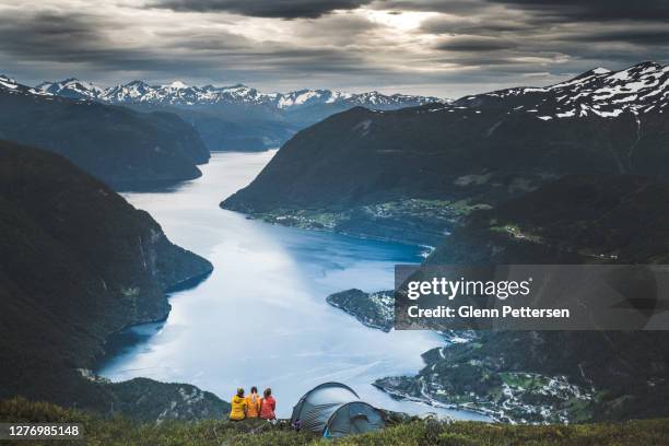 three girls caming in nature in norway. - sunnmore alps stock pictures, royalty-free photos & images