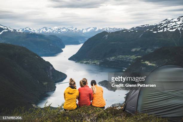 three girls caming in nature in norway. - daming lake stock pictures, royalty-free photos & images