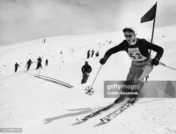 American alpine skier Suzy Harris Rytting makes a clever turn in the Harriman Cup slalom event on a Sun Valley slope, Idaho, 28th November 1951....