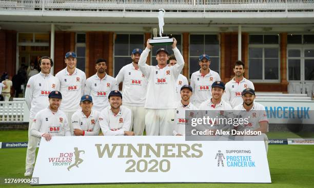 Tom Westley of Essex lifts the Bob Willis Trophy with teammates after Day 5 of the Bob Willis Trophy Final between Somerset and Essex at Lord's...