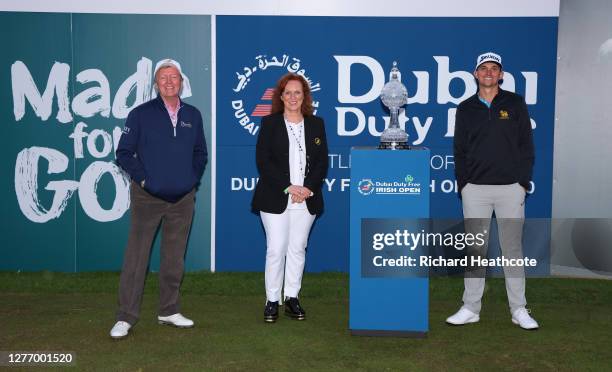 Des Smyth, Sinead El Sibai, Dubai Duty Free Senior Vice President of Marketing poses with champion John Catlin of the USA during Day Four of the...