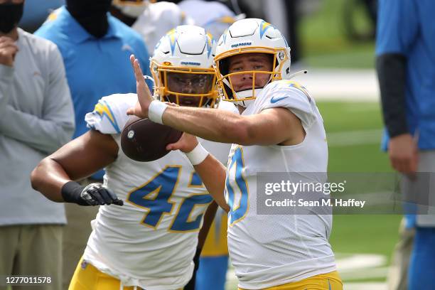 Justin Herbert of the Los Angeles Chargers throws a pass prior to a game against the Carolina Panthers at SoFi Stadium on September 27, 2020 in...