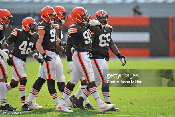 Defensive end Myles Garrett of the Cleveland Browns celebrates with teammates after a fumble recovery during the fourth quarter against the...