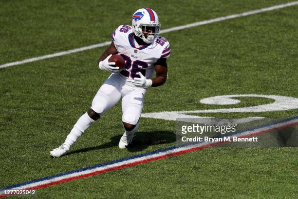 Devin Singletary of the Buffalo Bills runs with the ball during the first quarter against the Los Angeles Rams at Bills Stadium on September 27, 2020...