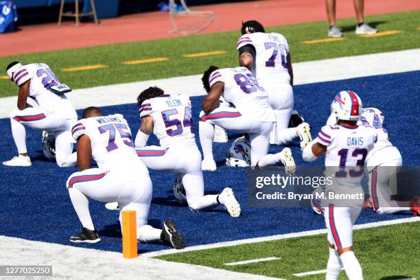 Buffalo Bills players kneel before a game against the Los Angeles Rams at Bills Stadium on September 27, 2020 in Orchard Park, New York.