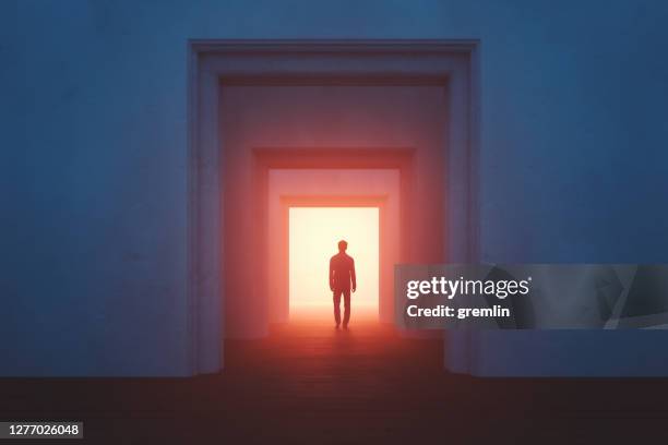 old rooms with sleepwalker walking into mysterious passage - illuminated corridor stock pictures, royalty-free photos & images