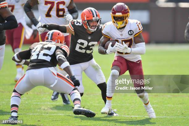 Strong safety Karl Joseph and free safety Andrew Sendejo of the Cleveland Browns pursue wide receiver Terry McLaurin of the Washington Football Team...