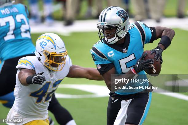 Uchenna Nwosu of the Los Angeles Chargers pressures Teddy Bridgewater of the Carolina Panthers from the pocket during the first half of a game at...