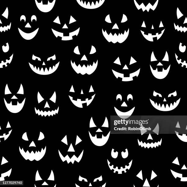 scary pumpkin faces seamless pattern - textile patch stock illustrations