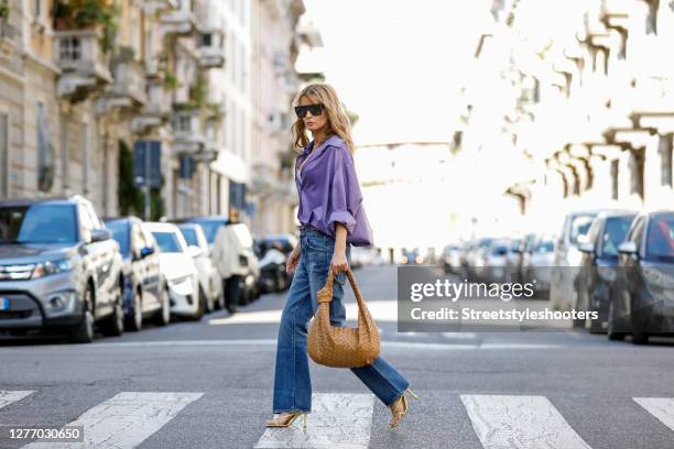 Influencer Gitta Banko, wearing a purple colored oversize blouse by Gitta Banko,a pearl necklace by Hermina Athens, a golden necklace by Bottega...