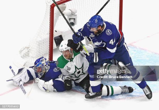 Andrei Vasilevskiy and Jan Rutta of the Tampa Bay Lightning defend against Corey Perry of the Dallas Stars and in Game Five of the 2020 NHL Stanley...