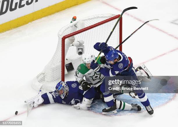 Andrei Vasilevskiy and Jan Rutta of the Tampa Bay Lightning defend against Corey Perry of the Dallas Stars and in Game Five of the 2020 NHL Stanley...