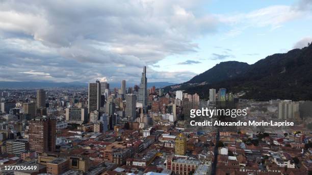 aerial view of the urban landscape full of high buildings surrounded of mountains in bogota, colombia - company town hall stock pictures, royalty-free photos & images