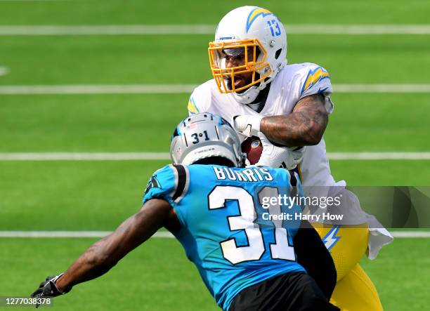 Keenan Allen of the Los Angeles Chargers runs after his catch in front of Juston Burris of the Carolina Panthers during the third quarter in a 21-16...